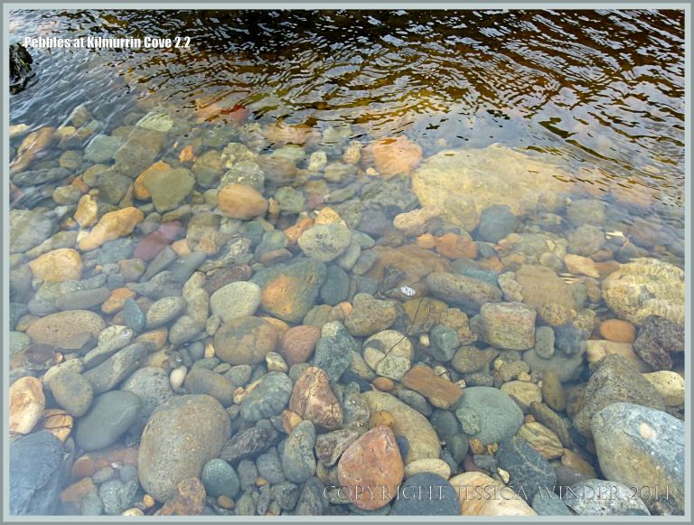 Pebbles underwater in a beach stream