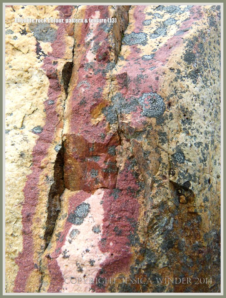 Rhyolite volcanic rock with red streaks