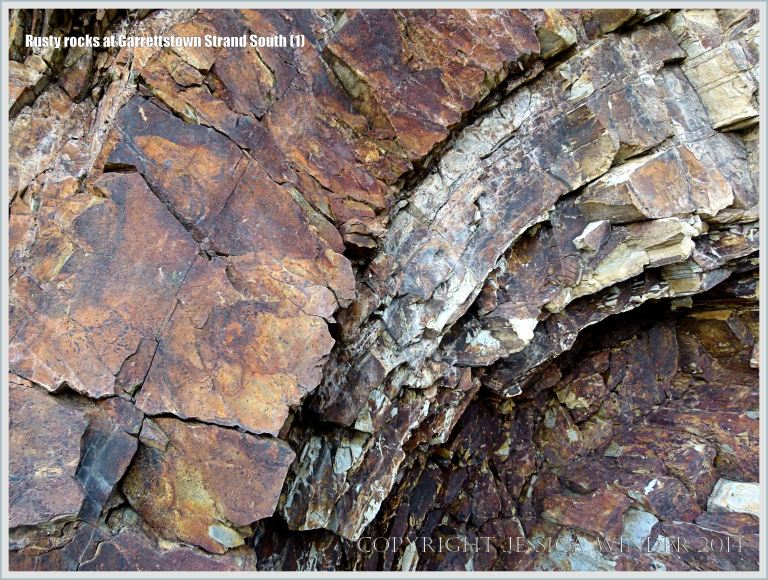 Iron-stained folded carboniferous sedimentary rock of the Cork Group