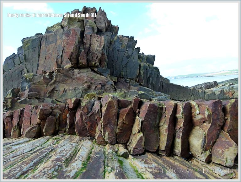Close-up of rocks layers coloured by their iron content
