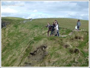 Visitors teetering near the edge of cliffs to take photographs
