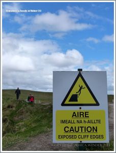 Warning sign on the stretch of cliffs with no barrier wall
