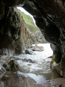 Arch through the limestone cliffs at Mewslade Bay