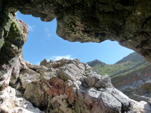 View through a blow-hole in the rocks at Mewslade Bay