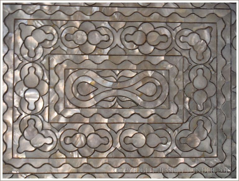 Ornamental iridescent veneer of mother-of pearl on an 18th century  bureau-bookcase