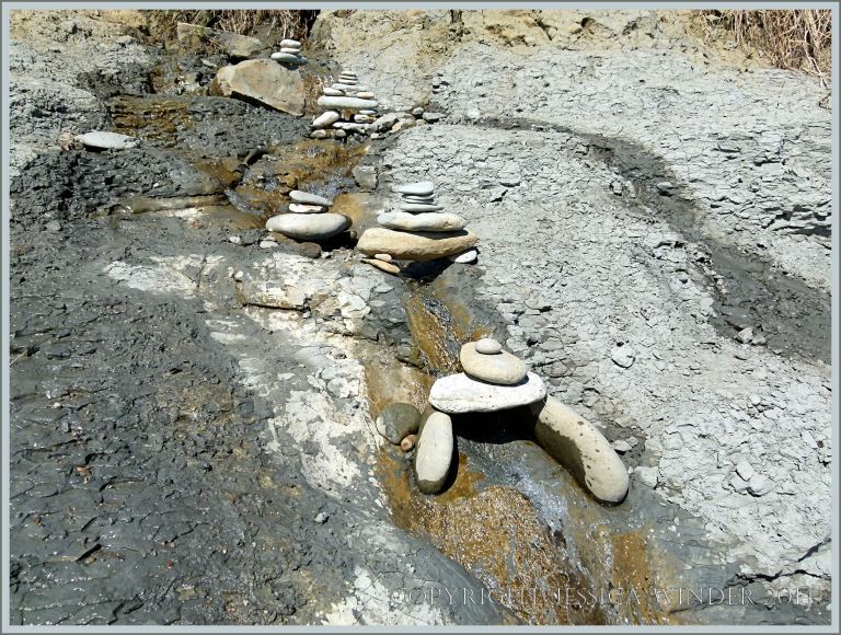 Little pebble bridges over a beach stream
