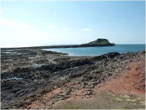 View of the exposed rock Worms Head Causeway at low tide