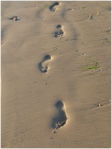Footprints in the sand at Rhossili Beach