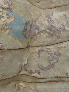 Rock pattern and texture in a beach boulder