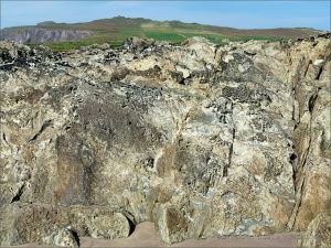 Texture, colour, and pattern in Silurian rock strata with weathered surface sculpturing on the beach at Ferriters Cove