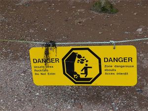 Warning sign of danger from falling rocks