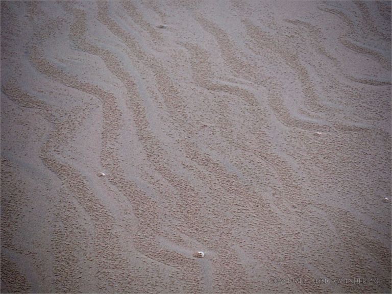 Natural sand patterns on Rhossili beach in Gower