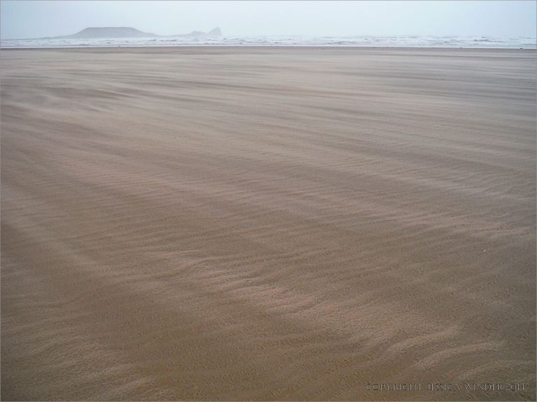 Natural sand patterns on Rhossili beach in Gower