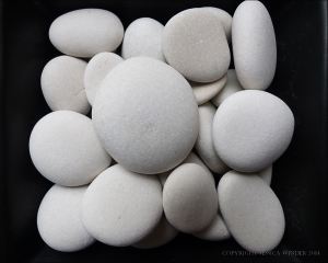 White pebbles on a black background