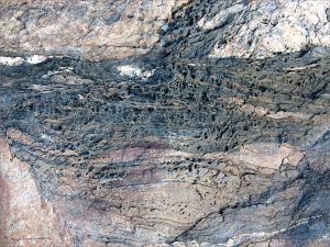 Colour and texture, possibly showing evidence of extrusive volcanic activity, in a rock outcrop near Four Mile Beach in Port Douglas