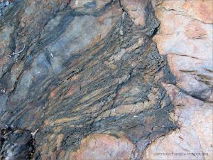 Colour and texture, possibly showing evidence of extrusive volcanic activity, in a rock outcrop near Four Mile Beach in Port Douglas