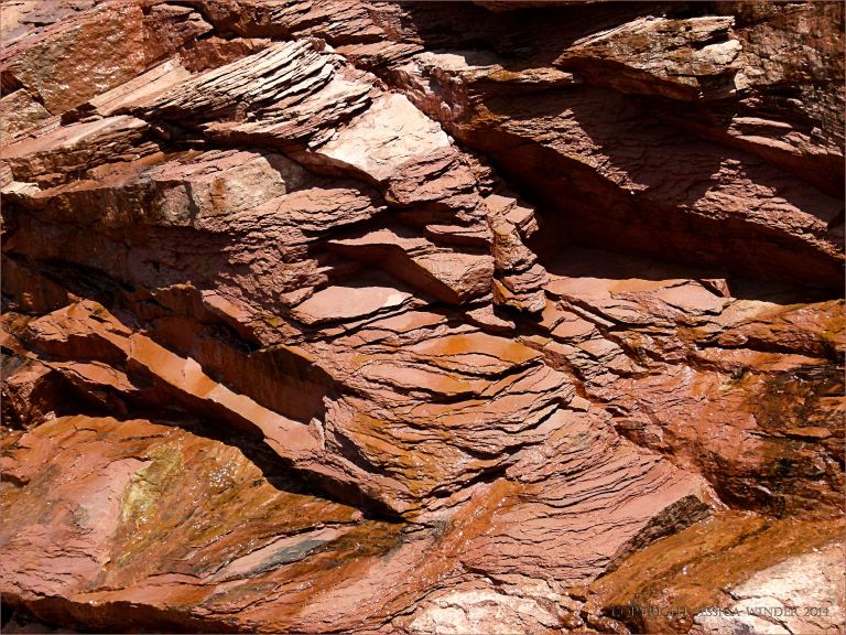 Red Triassic rocks in the cliff at Waterside beach, New Brunswick