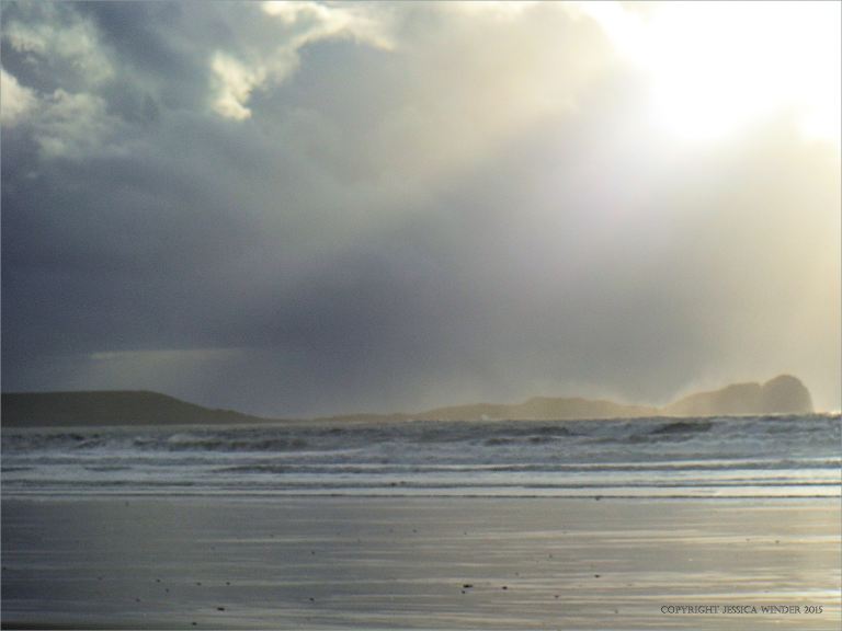 Cloud burst and sun shafts over Worms Head on the Gower Peninsula