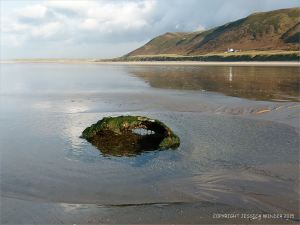 Rusty remains thought to be an old empty WWII mine on Rhossili beach