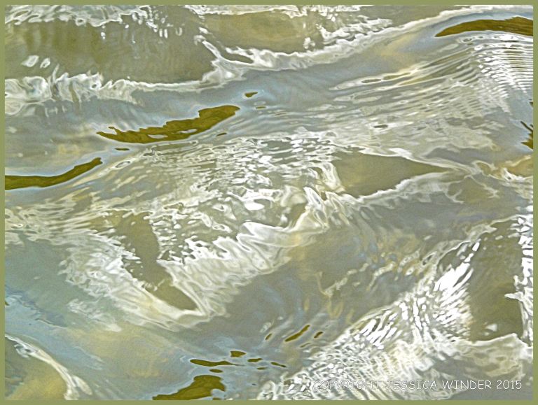 Light reflected on rippled water