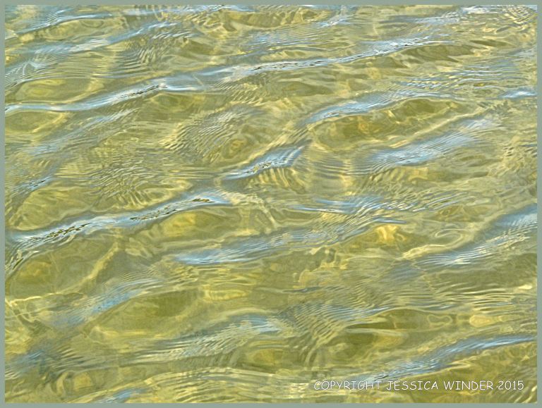 Light reflected on rippled water