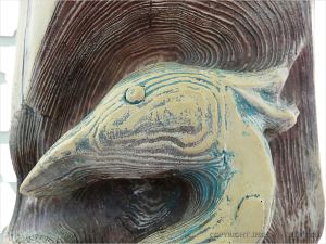 Wood carving of water bird on house in Eugene, Oregon.