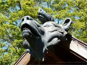Bronze wolf head and mythical beast on museum in Eugene, Oregon