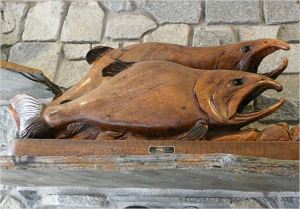 Carved wooden salmon wall decoration in Overleaf Lodge, Yachats, Oregon.