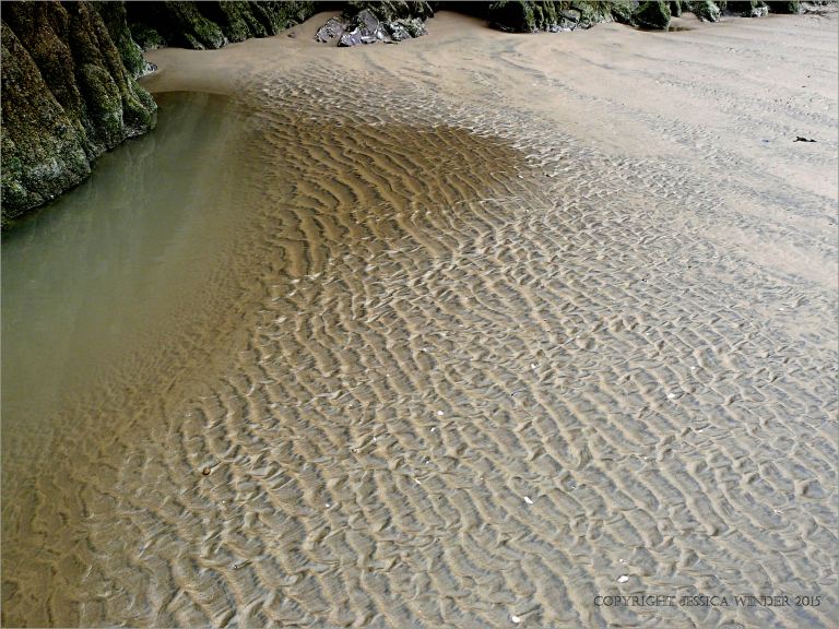 Wet sand ripples on Rhossili Beach