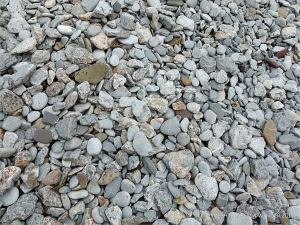 Pebbles on the water's edge at Pwll Du Bay
