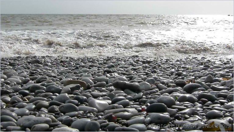 Sea-washed Carboniferous limestone pebbles at Pwll Du Bay