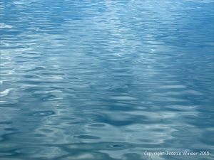 Gentle water ripples and reflected clouds in the Northumberland Strait