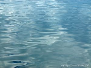 Gentle water ripples and reflected clouds in the Northumberland Strait