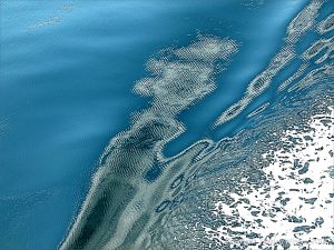 Seafoam pattern on the swell of a bow wave with micro-ripples from the engines of the passing ferry on the Northumberland Strait