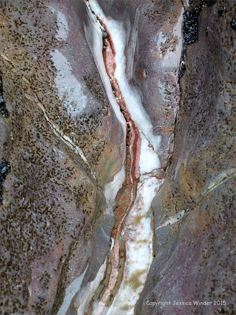 Crack in rock with calcite and heamatite