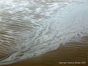 Silvery sand patterns at Rhossili Bay