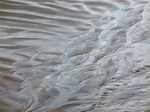 Silvery sand patterns at Rhossili Bay