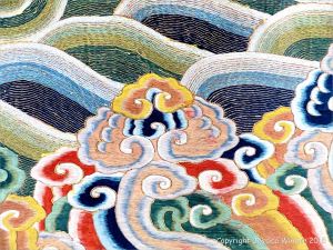 Chinese silk embroidery wave and surf design on a festive dragon robe from the Qing Dynasty