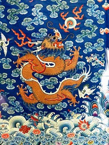 Chinese silk embroidery wave and surf design on a festive dragon robe from the Qing Dynasty