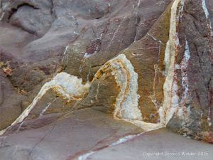 Interesting pattern of veins in rip-rap at Seaton in Devon, England