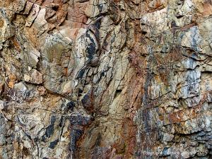 Color, pattern, and texture of rock in Park Guell in Barcelona, Spain