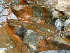 Cliff rock texture and colour at Kimmeridge Bay in Dorset, England