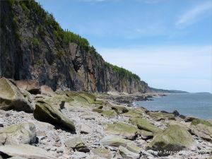 Cliffs and beach boulders at Cape Enrage