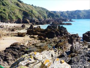 Outcrops of Icart Gneiss on the beach at Moulin Huet Bay