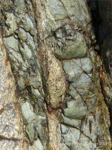 Contrasting rock textures at Moulin Huet Bay