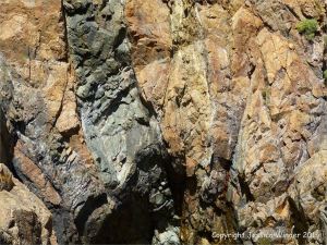 Dolerite dykes in Icart Gneiss cliffs at Moulin Huet Bay