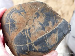 A beach stone made of iron on the Gower Peninsula in South Wales