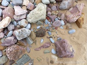 Pebbles on the upper shore of a Gower Peninsula beach in South Wales