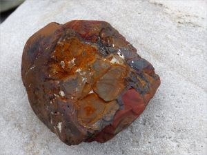 A beach stone made of iron on the Gower Peninsula in South Wales