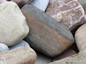 Beach stone of banded iron on the Gower Peninsula in South Wales
